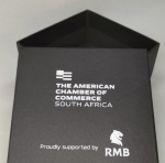 Square black base and lid box with a textured finish and white silkscreened branding.