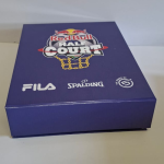 Deep blue hinged-lid rigid box featuring multi-brand logos on the front panel.