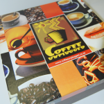 Multi-image printed gift box with a matte lamination finish and orange brand accents.