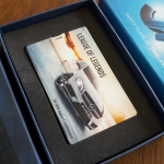 Blue branded box with a custom foam insert holding a Gift or Key card.