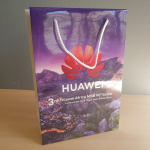 High-gloss paper bag featuring high-definition photographic landscape printing and white braided handles.