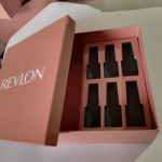 Square pink rigid box with high-precision white branding and a die-cut interior.