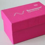 Small pink rigid box with silver-foiled pharmaceutical branding.