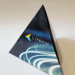 Three-dimensional triangular branded box featuring high-gloss graphics.