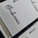 Technical detail of black silk-screened typography on a white textured in Wibalin paper.