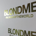 Gold gloss vinyl lettering applied to a clean white substrate.