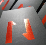 High-reflectivity foil logos on matte black, bright red, large area coverage