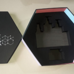 Hexagonal black rigid box featuring a custom-fit high-density foam insert.