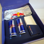 Custom-printed rigid box interior with a secondary card-stock insert and branded product.