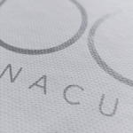 Silver metallic silk-screened branding on a heavily textured white paper substrate.