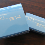 High-gloss sky blue tuck-in lid box with precision silver foil branding.